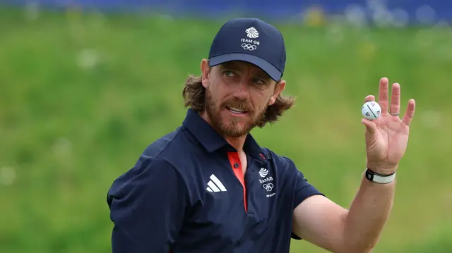 Tommy Fleetwood acknowledges the applause of the Paris 2024 crowd