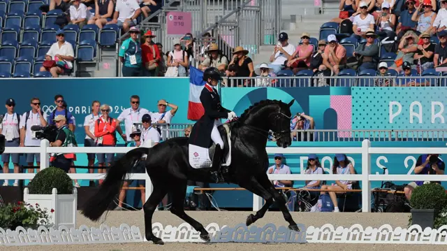 Charlotte Fry of Britain riding Glamourdale in action