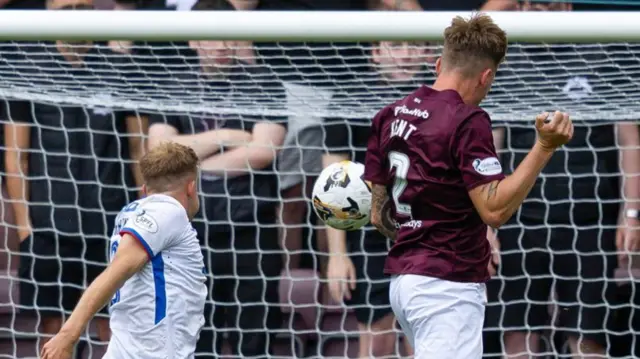 Frankie Kent aims a header at the Rangers goal