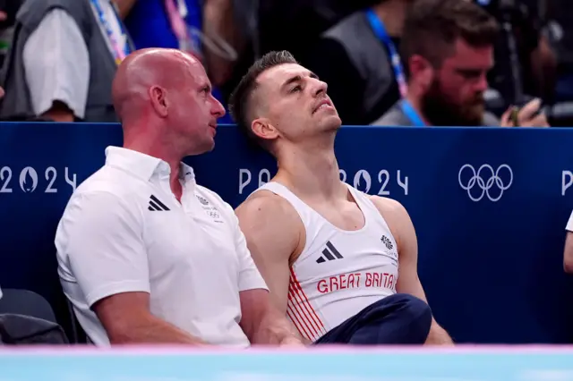 Whitlock sinks back in his chair after learning he won't medal