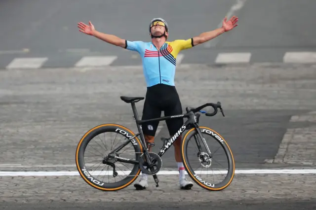 Remco Evenepoel of Team Belgium clebrates at finish line as Gold medal winner