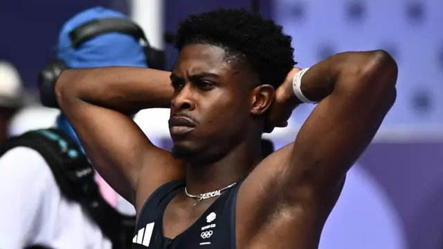 Jeremiah Azu of Britain reacts after after being disqualified for a false start in heat 1.