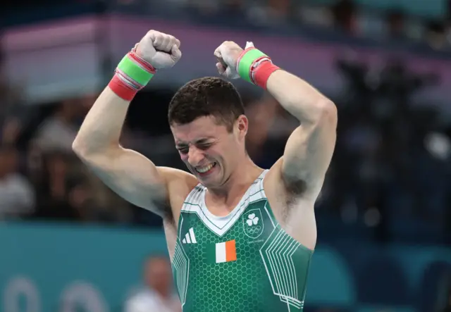 McClenaghan celebrates after nailing his routine