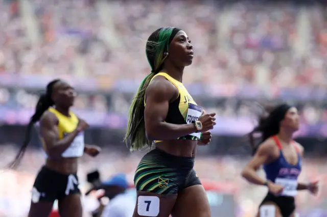 Fraser Pryce strolls after the heats