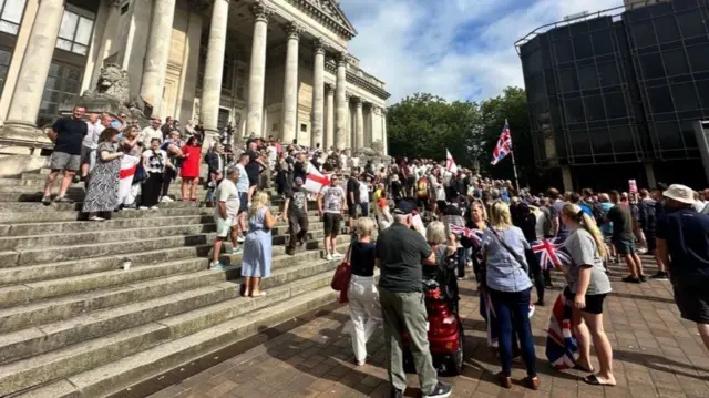 People gather in a square