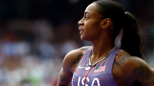 Sha'Carri Richardson looks on after winning her 100m heat