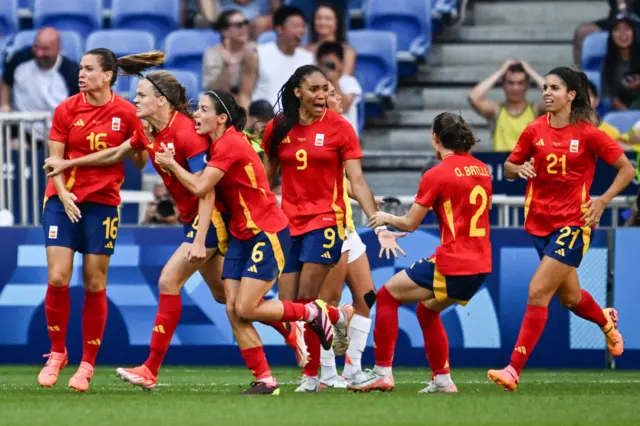 Spain's players celebrate after defender #04 Irene Paredes scored a goal