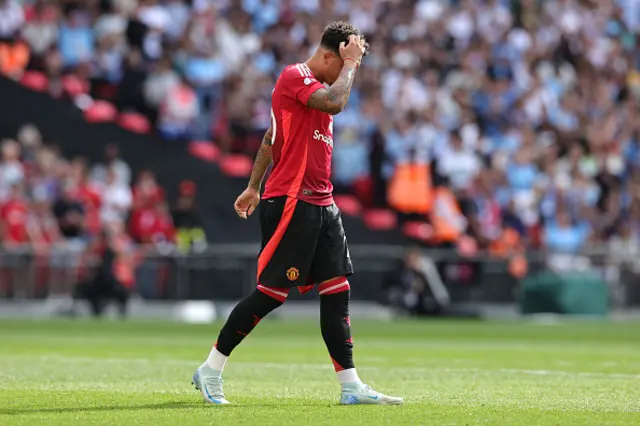 Jadon Sancho of Manchester United looks dejected