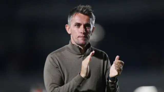 Kieran McKenna, Manager of Ipswich Town, applauds the fans