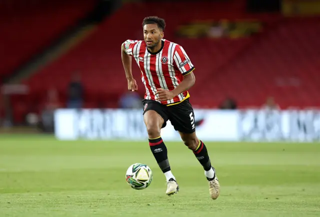 Auston Trusty of Sheffield United chases the ball