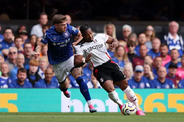 Adama Traore of Fulham battles for possession with Leif Davis