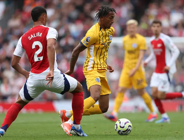 William Saliba of Arsenal and Joao Pedro battle for the ball