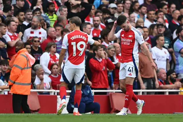 Declan Rice walks off after his red card