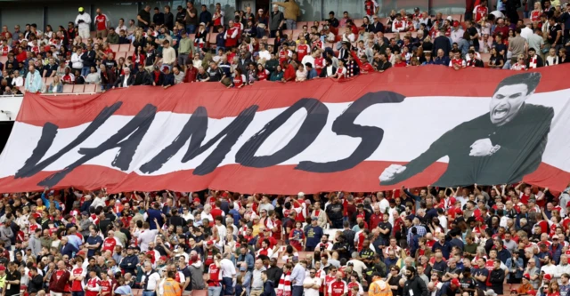 Arsenal fans display a banner of Arsenal manager Mikel Arteta