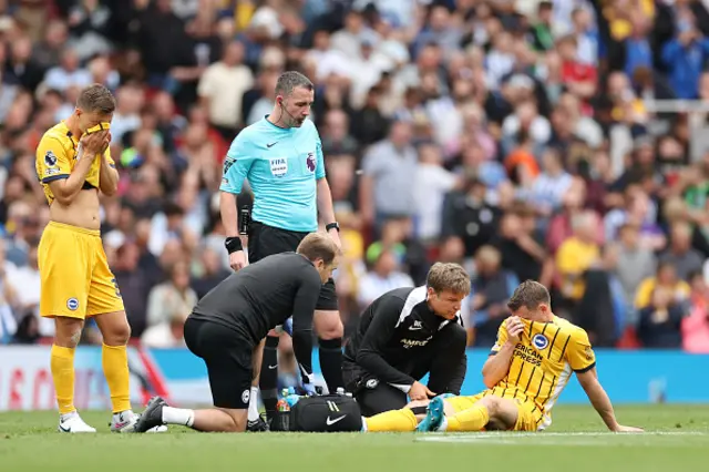 James Milner of Brighton & Hove Albion receives medical treatment