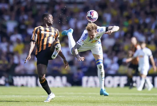 Hull City's Chirs Bedia and Leeds United's Joe Rodon battle for the ball