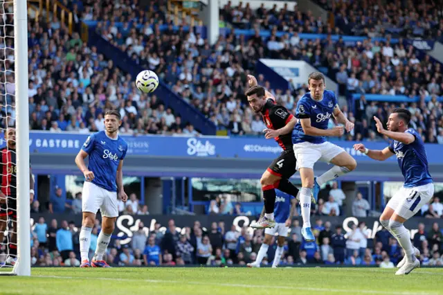 Lewis Cook of AFC Bournemouth scores his team's second goal under pressure from Seamus Coleman