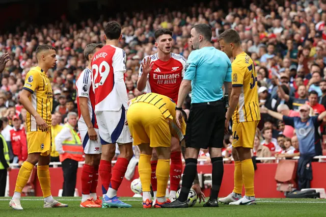 Declan Rice of Arsenal interacts with match referee Chris Kavanagh