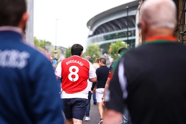 Fan wears an Odegaard shirt