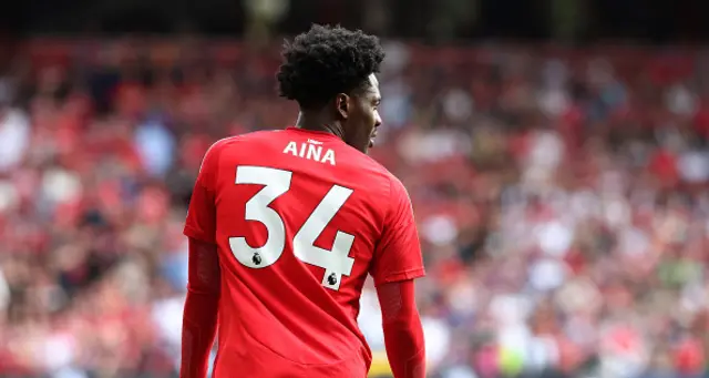 Ola Aina looks on