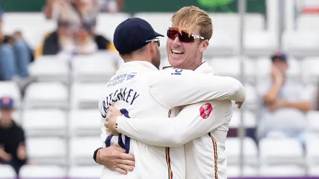 Essex players celebrate a wicket