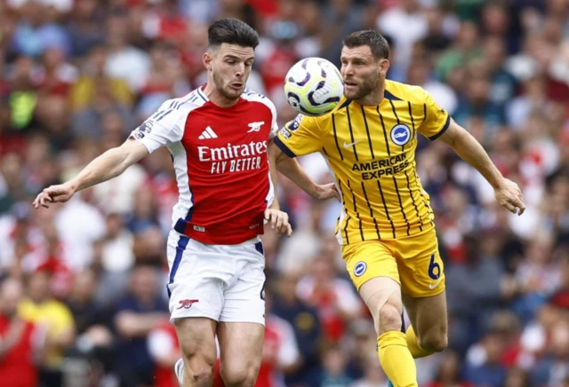 James Milner in action with Arsenal's Declan Rice