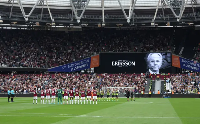 Players, match officials and fans take part in a minute's silence as a tribute to former football manager Sven-Goran Eriksson