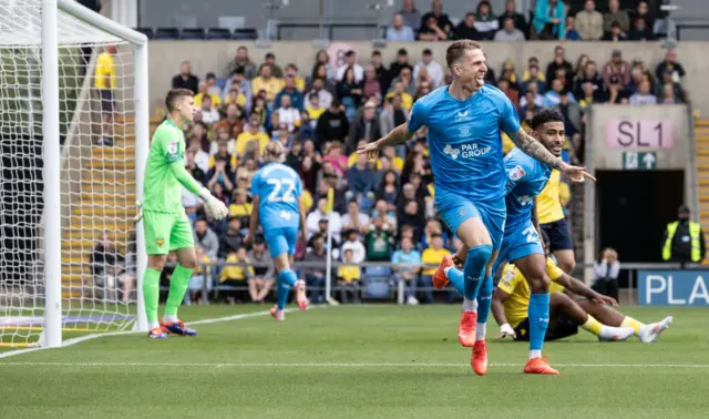 Emil Riis celebrates scoring for Preston at Oxford