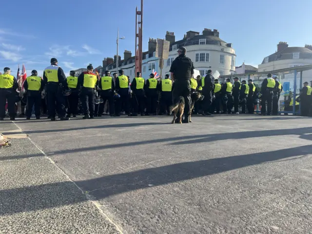 A line of riot police in Weymouth