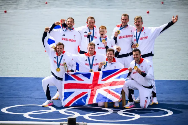 Great Britain's men's eight rowers celebrate with their gold medals at 2024 Paris Olympics