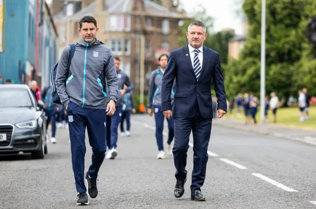 Dundee manager Tony Docherty (right) walks from Dens Park to Tannadice