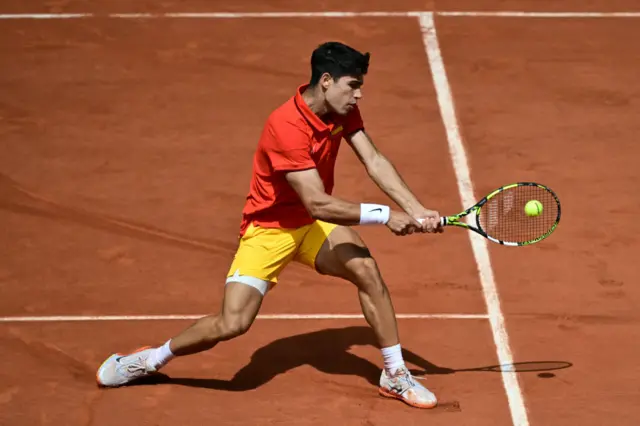 Spain's Carlos Alcaraz returns to Serbia's Novak Djokovic during their men's singles final tennis match on Court Philippe-Chatrier at the Roland-Garros Stadium