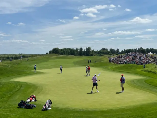 Tommy Fleetwood, Jon Rahm and Xander Schauffele on sixth green