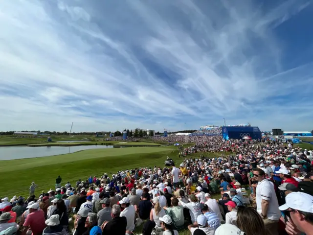 Tommy Fleetwood walks down 18th