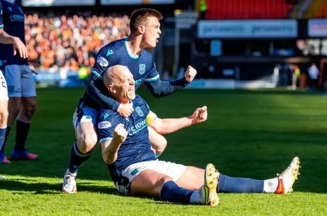 Charlie Adam celebrates a memorable goal for Dundee in a 2-2 draw