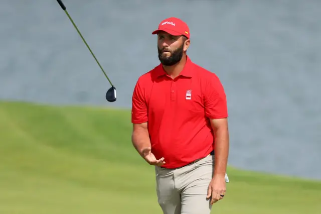 Rahm juggles his club after a poor shot