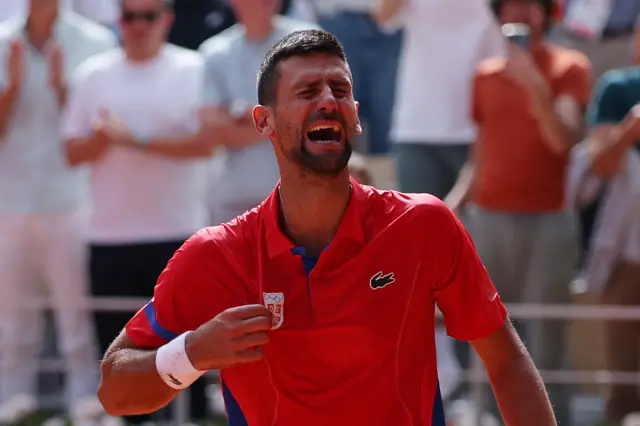 Novak Djokovic of Serbia reacts after winning gold against Carlos Alcaraz of Spain