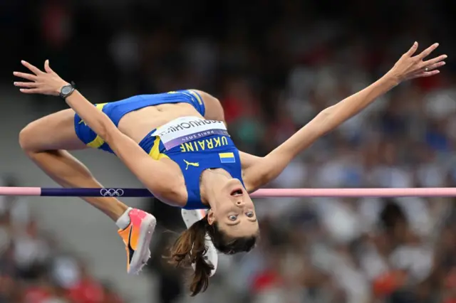 Mahuchikh executes her high jump to win gold