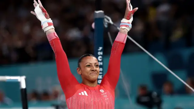 Rebecca Downie of Team Great Britain reacts after finishing her routine during the Artistic Gymnastics Women's Uneven Bars Final