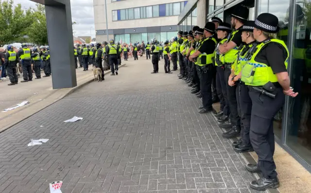 Police lined up outside a hotel in Rotherham