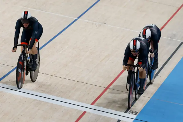 Britain complete a changeover in the team sprint