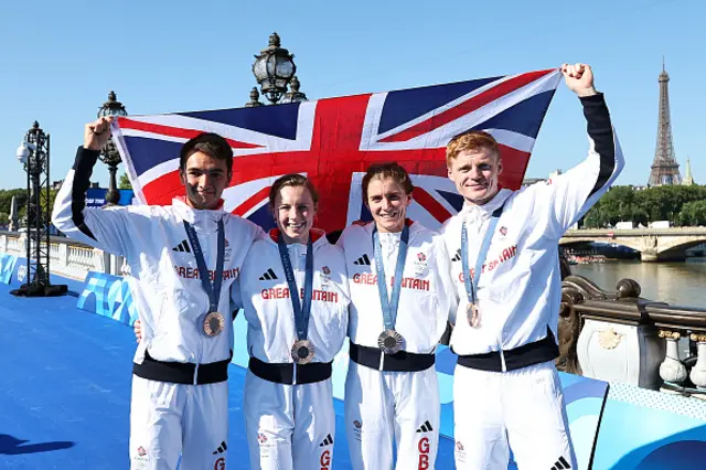 Bronze medalists Alex Yee, Georgia Taylor-Brown, Beth Potter and Samuel Dickinson of Team Great Britain celebrate