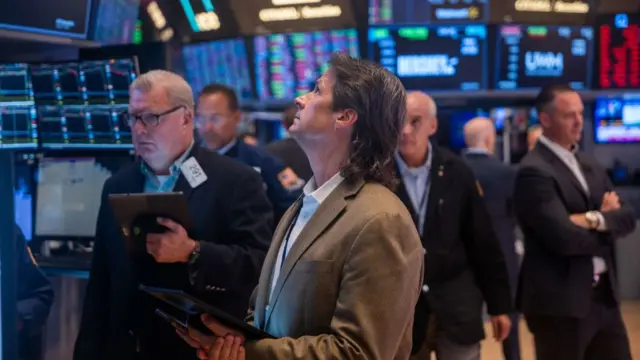 An investor looking at a trading screen