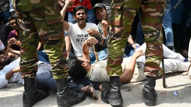 Students protest in front of army barricades in Dhaka, Bangladesh.