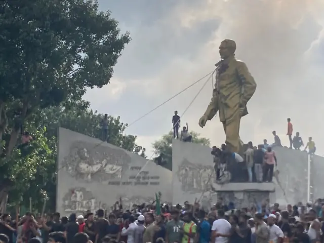 A statue of Sheikh Mujibur Rahman with ropes tied on