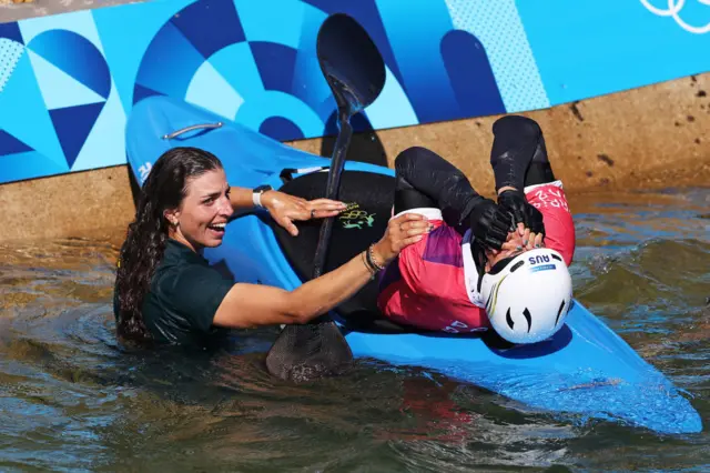 Jess Fox congratulates sister Noemie on her gold medal