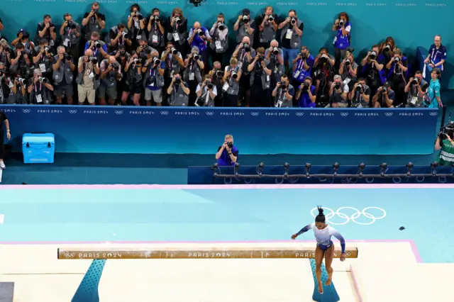 Simone Biles falls off the beam