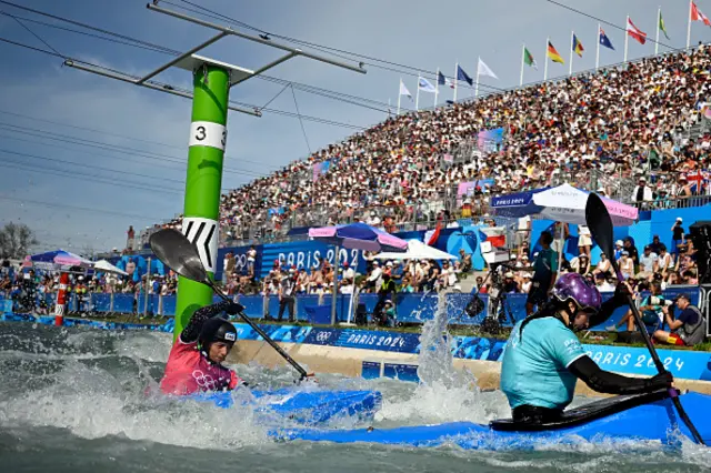 Andorra's Monica Doria Vilarrubla (L) and Britain's Kimberley Woods compete in the women's kayak cross