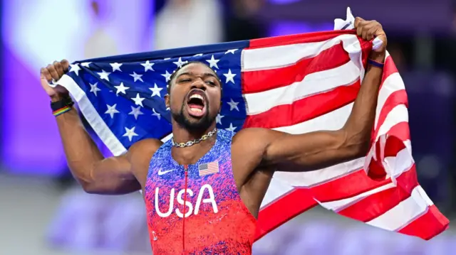 Noah Lyles celebrates Olympic 100m gold