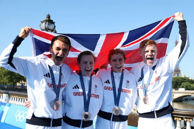 Team GB celebrate their bronze medal in the triathlon mixed team relay